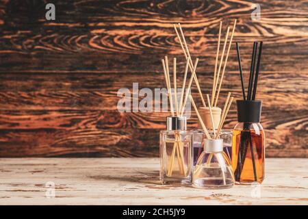 Different reed diffusers on table Stock Photo
