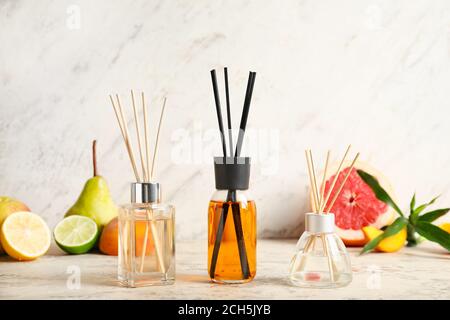 Different reed diffusers on table Stock Photo