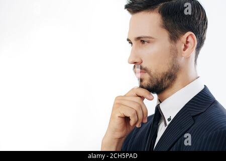 Pensive serious young businessman Stock Photo
