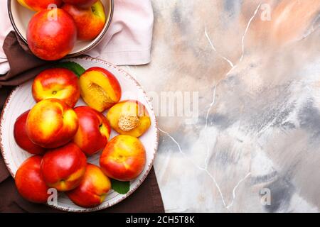 Composition with sweet ripe nectarines on table Stock Photo