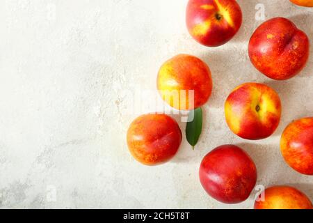 Sweet ripe nectarines on light background Stock Photo