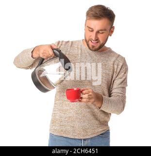 https://l450v.alamy.com/450v/2ch6451/young-man-pouring-hot-boiled-water-from-electric-kettle-into-cup-on-white-background-2ch6451.jpg