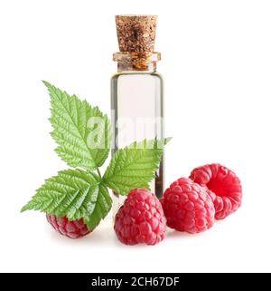 Bottle of raspberry essential oil on white background Stock Photo