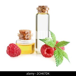Bottles of raspberry essential oil on white background Stock Photo