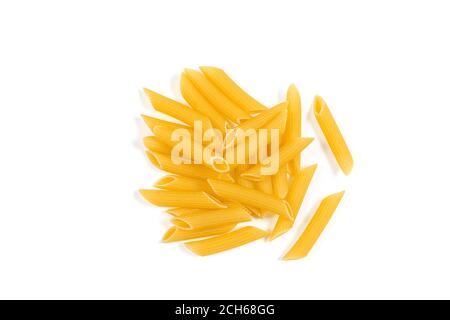 Uncooked penne pasta isolated on white background. Top view. Heap of dry penne pasta Stock Photo