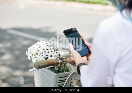 Woman checking map on smartphone Stock Photo