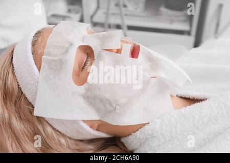 Woman undergoing procedure of carboxytherapy in beauty salon Stock Photo