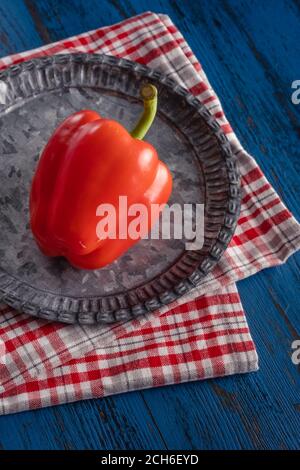 Fresh red paprika in rustic style on a blue wooden background Stock Photo