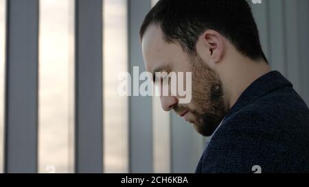 Young business man reading on the phone. Stock Photo