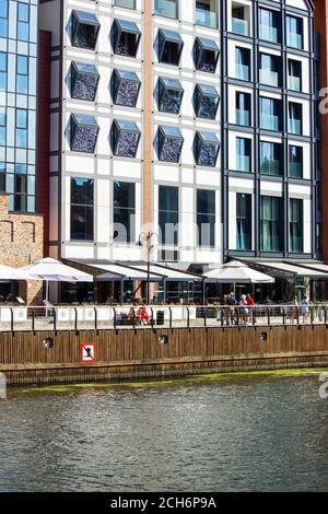 Gdansk, North Poland - August 14, 2020: Building exterior and restaurant located in the porch over motlawa river Stock Photo