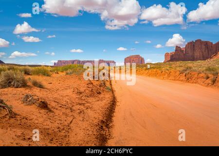 Road and red rocks in Monument Valley. Navajo Tribal Park landscape, Utah/Arizona, USA Stock Photo