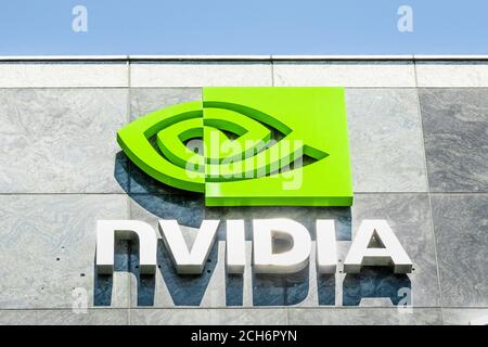 August 9, 2019 Santa Clara / CA / USA - The NVIDIA logo and symbol displayed on the facade of one of their office buildings located in the Company's c Stock Photo