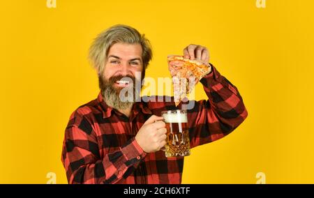 eating pizza and drinking. take-away pizza. Best party here. bachelor men club. Having fun and drink in bar. nice pub menu. man watching football while drinking beer and eating pizza. Stock Photo