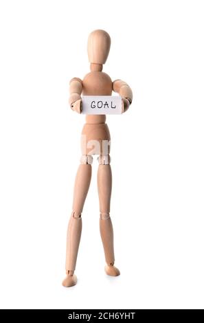 Wooden human figure holding paper with word GOAL on white background Stock Photo