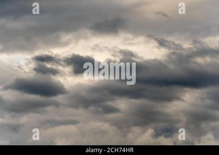 Dramatic thunderstorm clouds in dusk sky during rain. Amazing view of natural cloudiness weather background Stock Photo