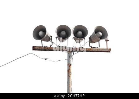 Row of loudspeakers on old rusty pole isolated on white Stock Photo