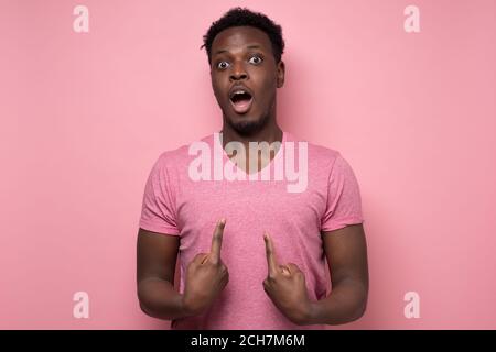 man looking at camera pointing at himself with hands being surprised Stock Photo