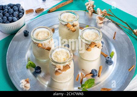 Milk rice pudding in pot with cinnamon Stock Photo