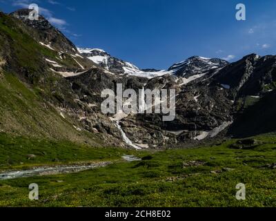 Charming scenery of big waterfalls, wild rivers and picturesque meadows of Alps in National park Hohe Tauern near Kaprun, Austria, Europe. Stock Photo
