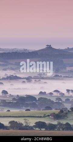 Marshwood Vale, Bridport, Dorset, UK. 14th Sep, 2020. UK Weather: Early morning mist rises from the beautiful rural landscape of the Marshwood Vale giving an autumnal start to what is set to be a glorious sunny day as the September heatwave continues. The iconic Colmer's Hill is seen in the distance. Credit: Celia McMahon/Alamy Live News Stock Photo