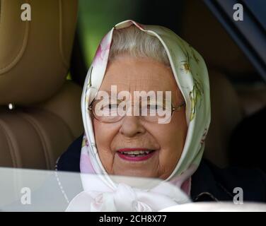 Queen Elizabeth II looks out of the window of her car, as she attends the fourth day of the Royal Windsor Horse Show, which is held in the grounds of Windsor Castle in Berkshire. Stock Photo