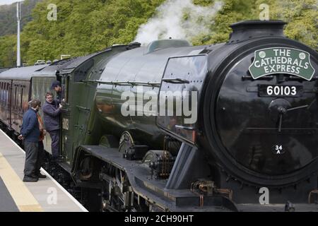 Flying Scotsman crew exit the train as it arrives at Tweedbank railway station from Edinburgh's Waverley station to Tweedbank in the Borders, as it continues its tour of Britain after Network Rail reversed a decision to cancel trips at short notice.