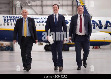 Chancellor of the Exchequer George Osborne (centre) is joined by former adversaries Ed Balls (right) and Sir Vince Cable, in the Ryanair hangar at Stansted Airport, where he said that 450 jobs and almost &Acirc;&pound;1 billion in investment announced by Ryanair would be 'at risk if we left the EU'. Stock Photo