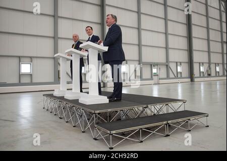 Chancellor of the Exchequer George Osborne (centre) is joined by former adversaries Ed Balls (right) and Sir Vince Cable, in the Ryanair hangar at Stansted Airport, where he said that 450 jobs and almost &Acirc;£1 billion in investment announced by Ryanair would be 'at risk if we left the EU'. Stock Photo