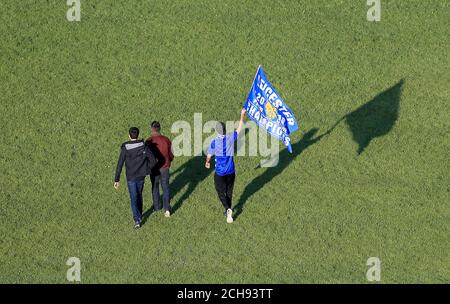 Leicester City fans celebrate in Victoria Park during the open top bus parade through Leicester City Centre. Stock Photo