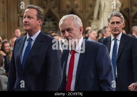 Prime Minister David Cameron and Labour leader Jeremy Corbyn and Foreign Secretary Philip Hammond pass through the Central Lobby the State Opening of Parliament at the Palace of Westminster in London. Stock Photo