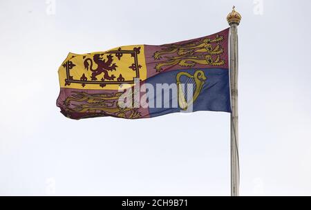 The Royal Standard flies above Buckingham Palace in central London. Scotland Yard has said that a 41-year-old man was arrested after scaling a perimeter wall at the palace Wednesday night. Stock Photo