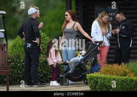 Una Healy (centre) talks to Ronan Keating and Storm Keating during the ISPS HANDA Mike Tindall Celebrity Golf Classic in aid of Rugby For Heroes and The Matt Hampson Foundation, at the Belfry Golf & Resort Hotel in Sutton. Stock Photo