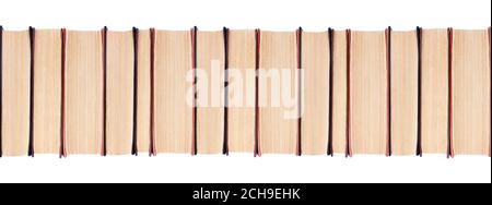 Row of old paper books on white background isolated close up, textbooks spine pattern, long line of hardcover books, education concept, wide border Stock Photo