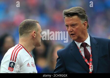 Manchester United manager Louis van Gaal (right) and Manchester United's Wayne Rooney in conversation before kick off during the Emirates FA Cup Final at Wembley Stadium. PRESS ASSOCIATION Photo. Picture date: Saturday May 21, 2016. See PA story SOCCER Final. Photo credit should read: Nick Potts/PA Wire. RESTRICTIONS: EDITORIAL USE ONLY No use with unauthorised audio, video, data, fixture lists, club/league logos or 'live' services. Online in-match use limited to 75 images, no video emulation. No use in betting, games or single club/league/player publications. Stock Photo