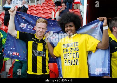 Burton Albion players celebrate promotion after the Sky Bet League