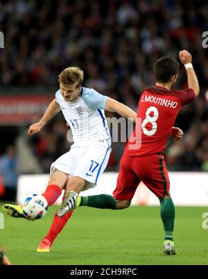 England's Eric Dier and Portugal's Joao Moutinho (right) in action during the International Friendly at Wembley Stadium, London. PRESS ASSOCIATION Photo. Picture date: Thursday June 2, 2016. See PA story soccer England. Photo credit should read: David Davies/PA Wire. RESTRICTIONS: Use subject to FA restrictions. Editorial use only. Commercial use only with prior written consent of the FA. No editing except cropping. Call +44 (0)1158 447447 or see www.paphotos.com/info/ for full restrictions and further information. Stock Photo