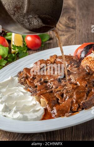 Turkish Traditional iskender kebap or doner kebab. Stock Photo