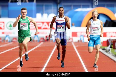 Great Britain's Zharnel Hughes (centre), Ireland's Marcus Lawler (left) and Finland's Samuli Samuelsson (right) compete in the Men's 200m heats during day two of the 2016 European Athletic Championships at the Olympic Stadium, Amsterdam. Stock Photo