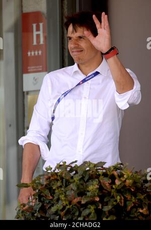 Wales manager Chris Coleman waves as he arrives back at the Golden Tulip hotel in Lyon. Wales were knocked out at the semi-final stage of the 2016 European Championships after losing 2-0 to Portugal. Stock Photo