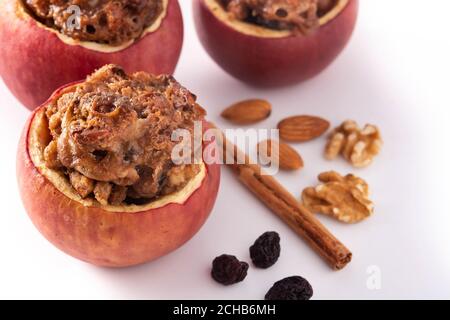 Stuffed apples baked with nuts isolated on white background Stock Photo