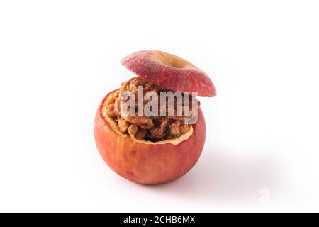 Stuffed apples baked with nuts isolated on white background Stock Photo