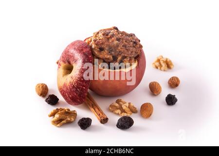 Stuffed apples baked with nuts isolated on white background Stock Photo