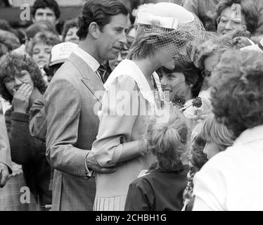 Prince Charles with his arm around the Princess of Wales as they meet the crowds at Charlottetown, Prince Edward Island, during their tour of Canada. Stock Photo