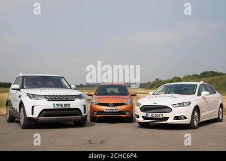 EMBARGOED TO 0001 THURSDAY JUNE 22 EDITORIAL USE ONLY Connected car research vehicles belonging to Jaguar Land Rover, Tata Motors European Technical Centre and Ford line-up during a media demonstration at the HORIBA MIRA proving ground in Nuneaton, Warwickshire. Stock Photo