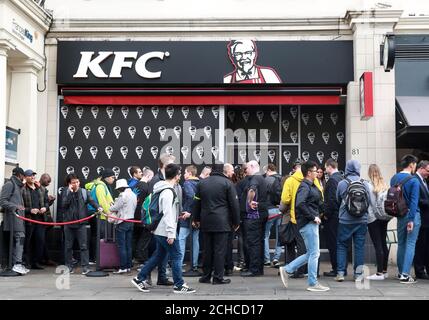 Customers queue outside a branch of KFC in Gloucester Road in London, to try the 'Double Down', which is a bun-less burger that features two Original Recipe chicken fillets, and will be on sale in the UK for 6 weeks only from October 9th. Stock Photo