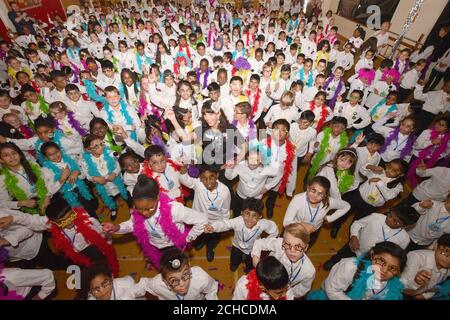 EDITORIAL USE ONLY Author Liz Pichon and 314 pupils from Horsenden Primary School in Middlesex break a Guinness World Records title for largest disco dance, which had previously been 280, to celebrate the launch of Liz's new book Tom Gates:Epic Adventure (Kind of!) published by Scholastic UK.  Stock Photo