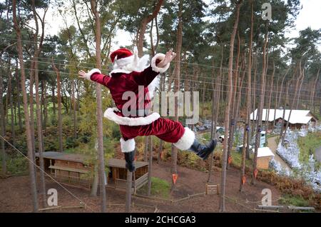 Santa jumps from the top of The Drop, a 15-metre tall tower which has ...