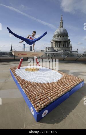 EDITORIAL USE ONLY  Olympic gymnast Max Whitlock performs on a pommel horse over a crash mat made entirely from British Lion eggs in London, as he prepares with a high-protein diet ahead of his participation in the Commonwealth Games, which starts on April 4th in Australia's Gold Coast. Stock Photo