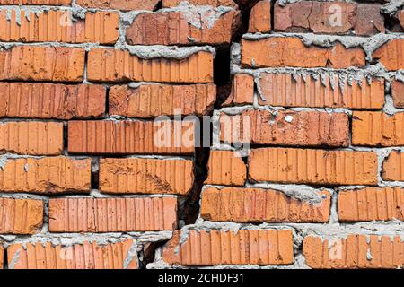 Сrack in a red brick wall. Stock Photo