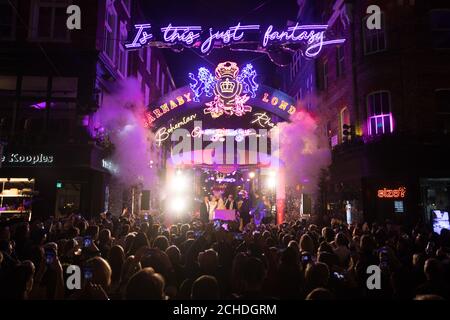 EDITORIAL USE ONLY Brian May and Roger Taylor help to launch a light installation celebrating the Queen song Bohemian Rhapsody at Carnaby Street in London. The lights featuring Freddie Mercury's lyrics will illuminate the street until January, in honour of the upcoming movie.  Stock Photo